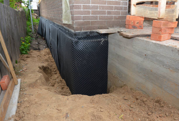 Happy homeowners after waterproofing job in Atco